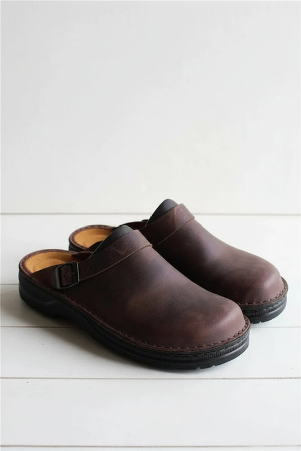 Black unisex slip-on clogs with superior cushioning. Perfect casual footwear for all-day comfort & support.