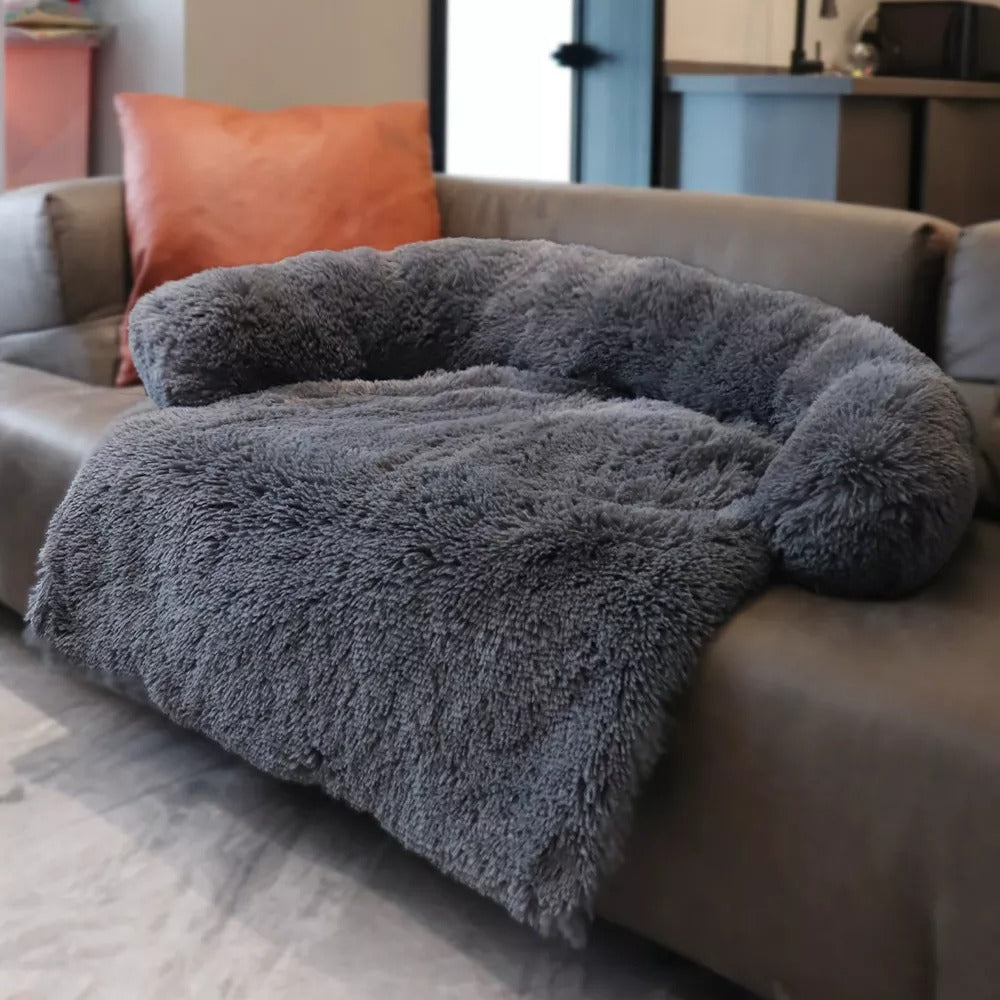 Pink faux fur pet calming sofa bed, soft anti-anxiety dog bed for small to medium pets