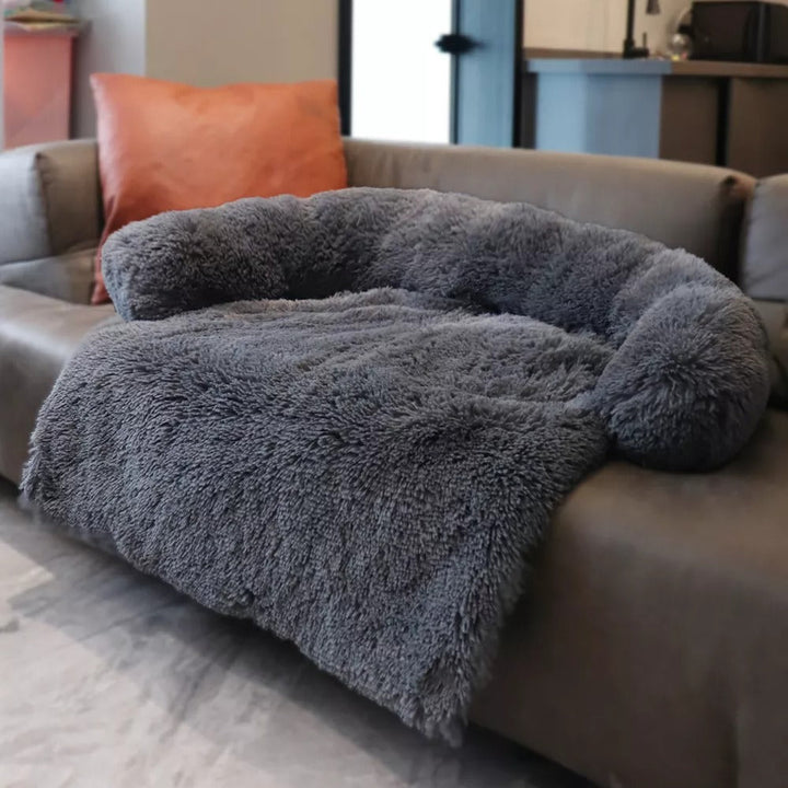 Pink faux fur pet calming sofa bed, soft anti-anxiety dog bed for small to medium pets