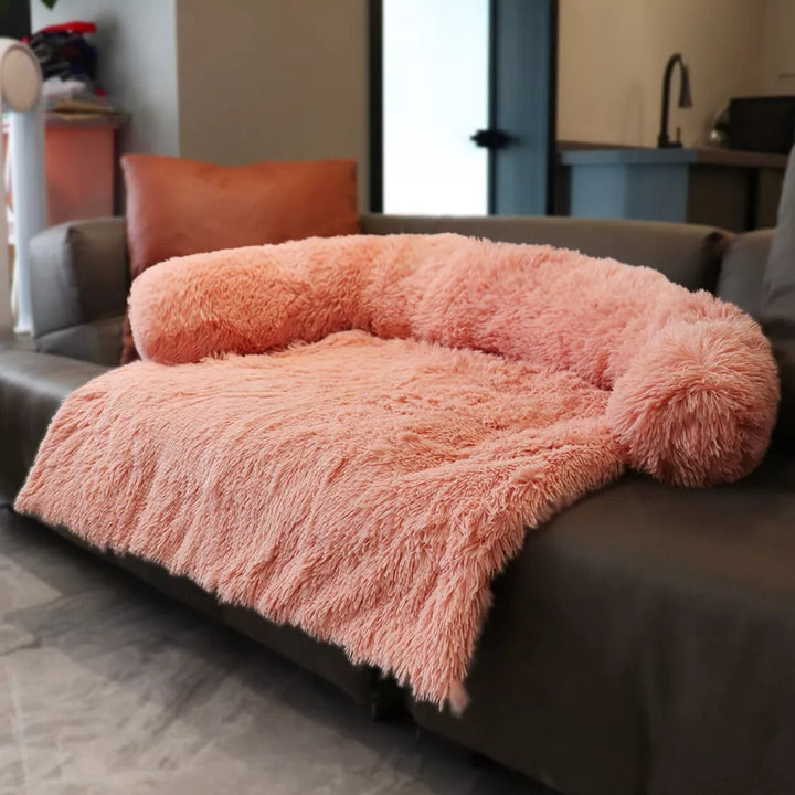 Close-up of the plush faux fur of a light gray pet calming sofa bed, washable dog bed
