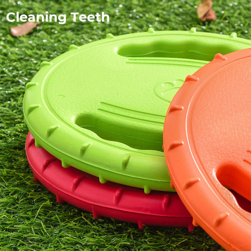 Durable dog toy flying disc in red, excellent for fetch and active outdoor adventures.