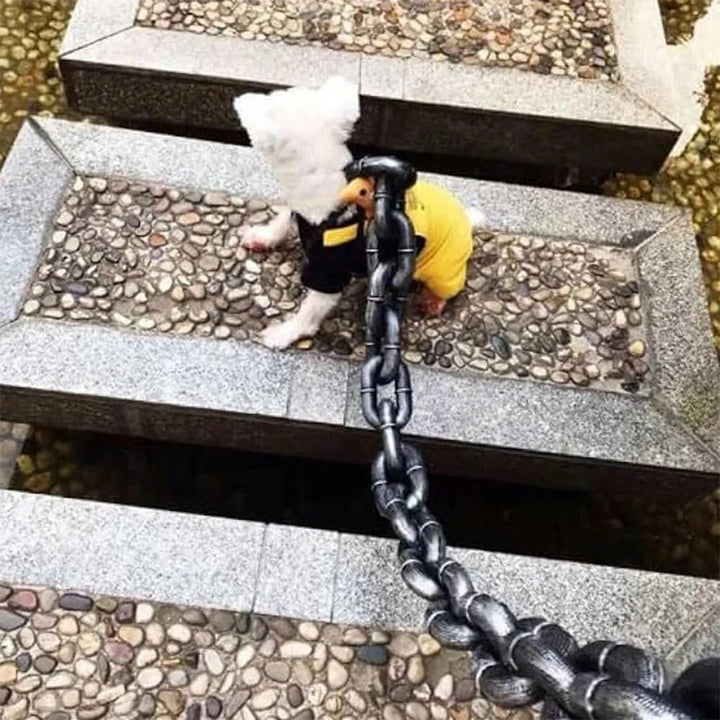 Ergonomic handle on a realistic chain-look dog leash, ensuring comfortable dog walking
