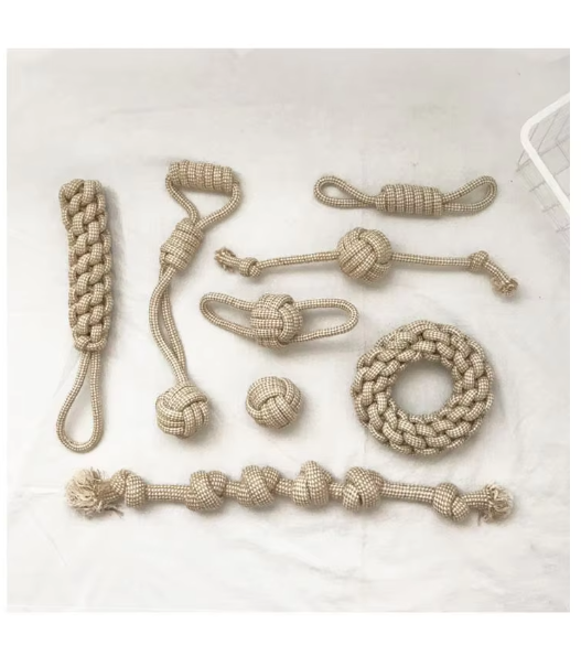 Assorted dog rope toys showing different textures, aiding in canine teeth cleaning.