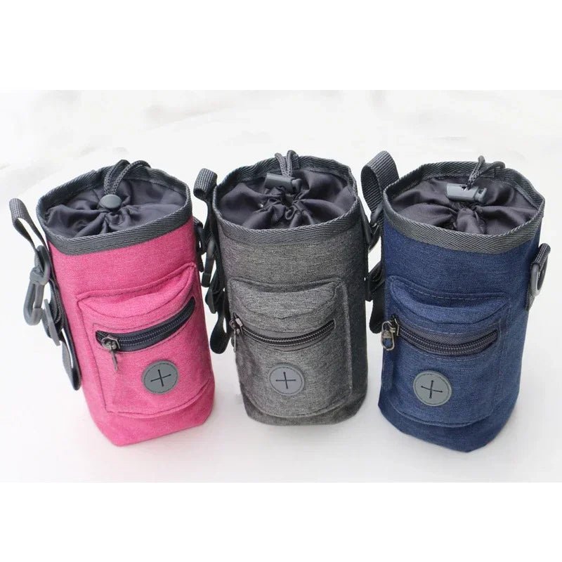 Black dog treat training pouch with built-in poop bag dispenser, essential pet supplies for walks.