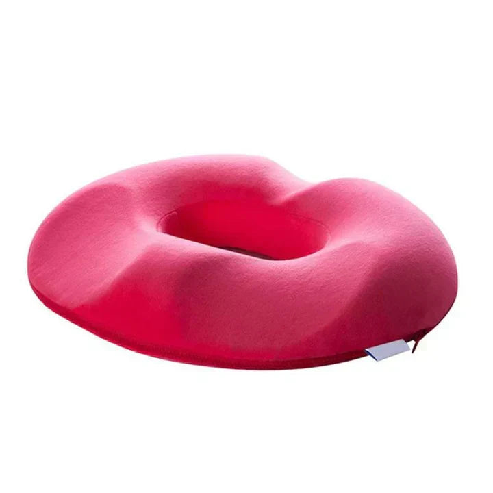 Portable donut car seat cushion for comfortable travel, alleviating hemorrhoid & tailbone pain.