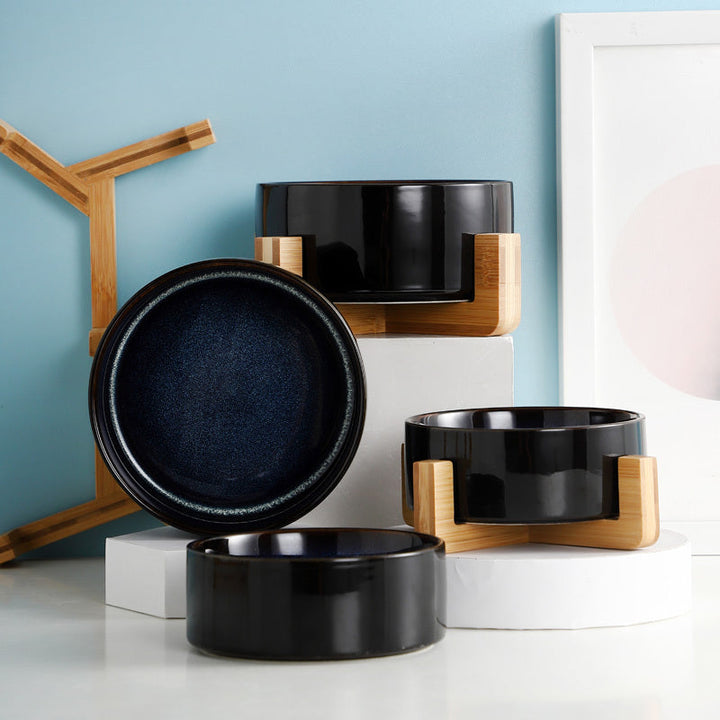 Double diner pet bowl set with sturdy bamboo stand and starry sky ceramic dishes for pets.
