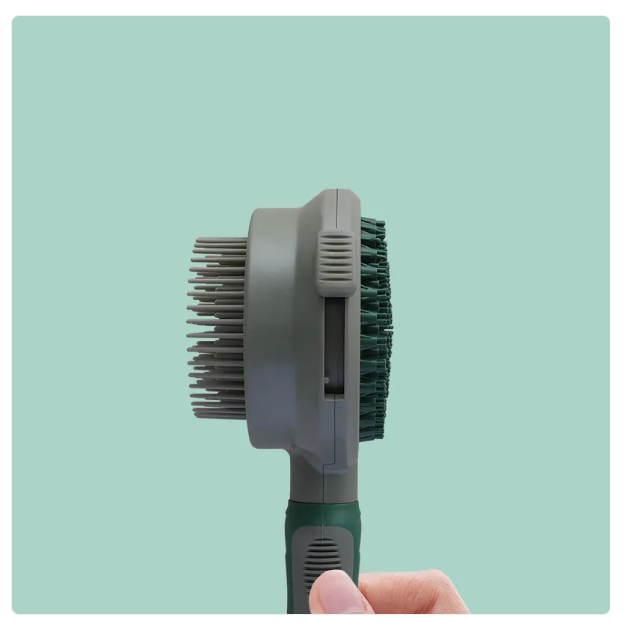 Image of a durable double-sided cat grooming brush, perfect for all types of cat fur and pet care needs