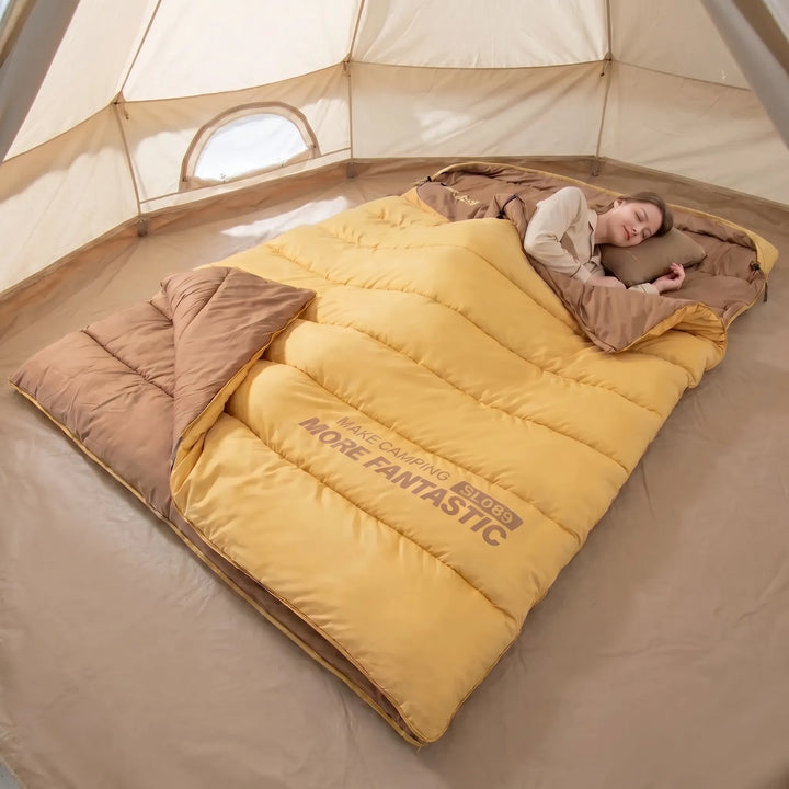Unisex double sleeping bag for cozy 4-season camping & hiking adventures. Warm, shared outdoor comfort.