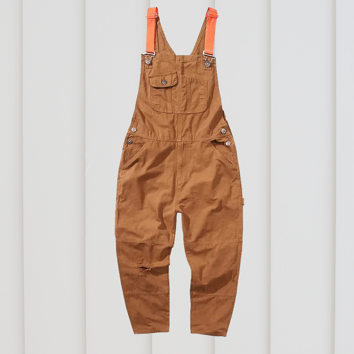 Unisex garden dungarees with multiple pockets, adjustable straps; ideal durable workwear for outdoor tasks.