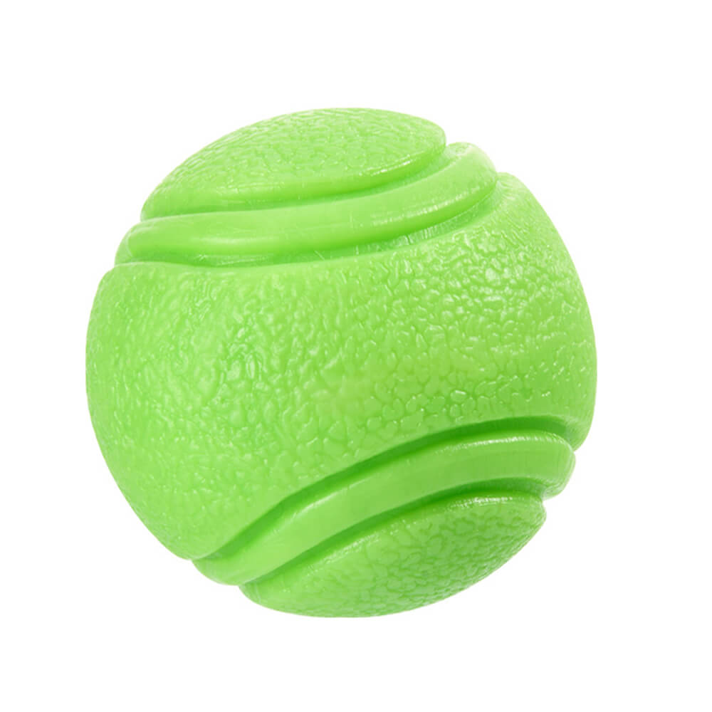 Pet owner throwing an elastic floating dog toy ball for a dog to fetch in the park