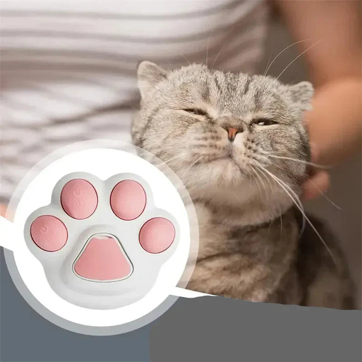 Hand holding a unisex pet spray brush, demonstrating comfortable grip for dog grooming