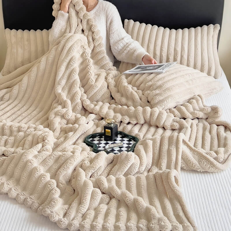 Unisex faux rabbit fur plush sofa throw blanket in a cozy living room setting, soft & warm decor.