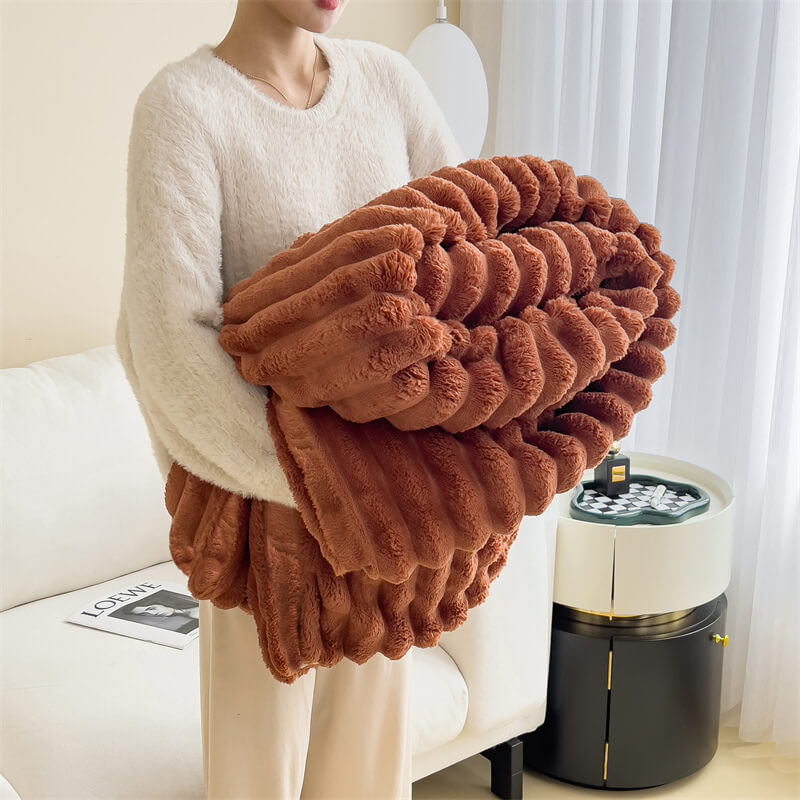 Detail shot of the fluffy texture of the faux rabbit fur plush sofa throw blanket.