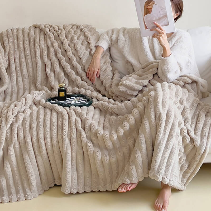 Elegant faux rabbit fur throw blanket adding a touch of luxury to a modern living space.