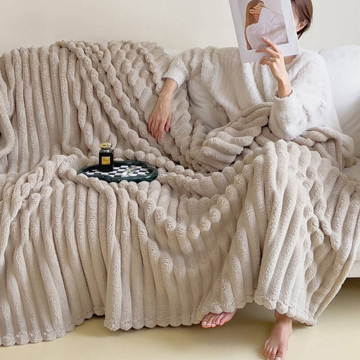 Elegant faux rabbit fur throw blanket adding a touch of luxury to a modern living space.