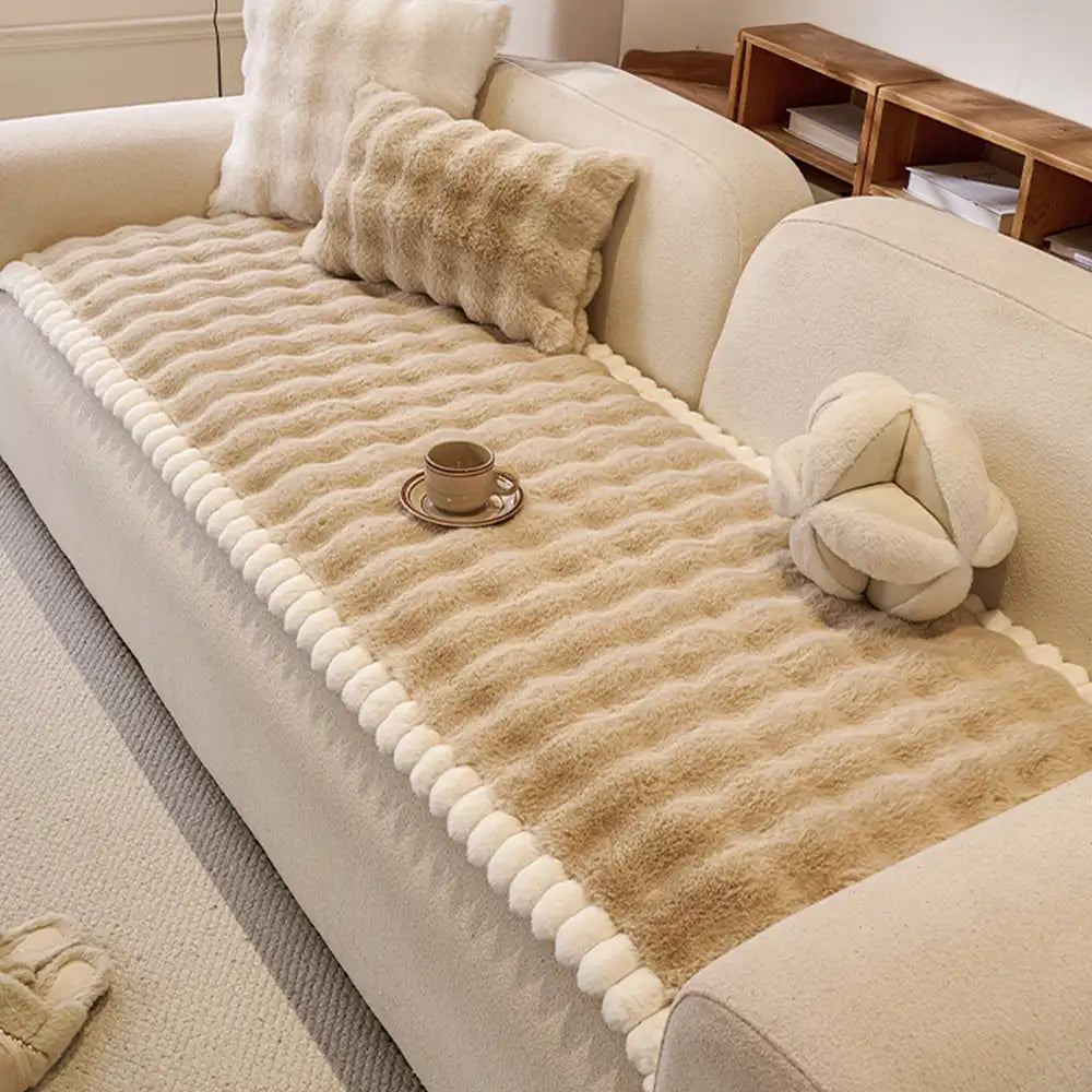 Washable faux rabbit plush sofa cover protecting a white couch, non-slip and pet friendly