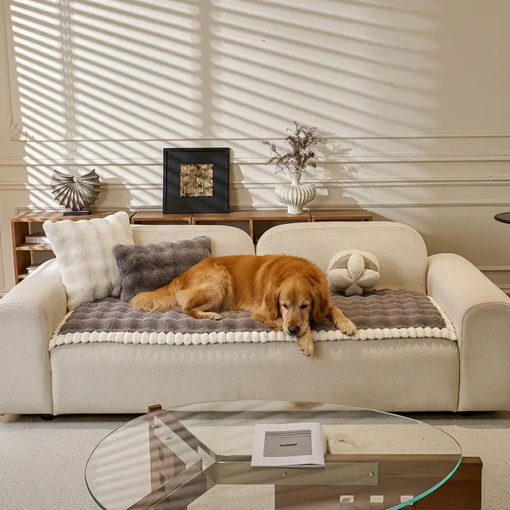 Faux rabbit plush sofa protector in a modern living room, non-slip and cozy home decor piece