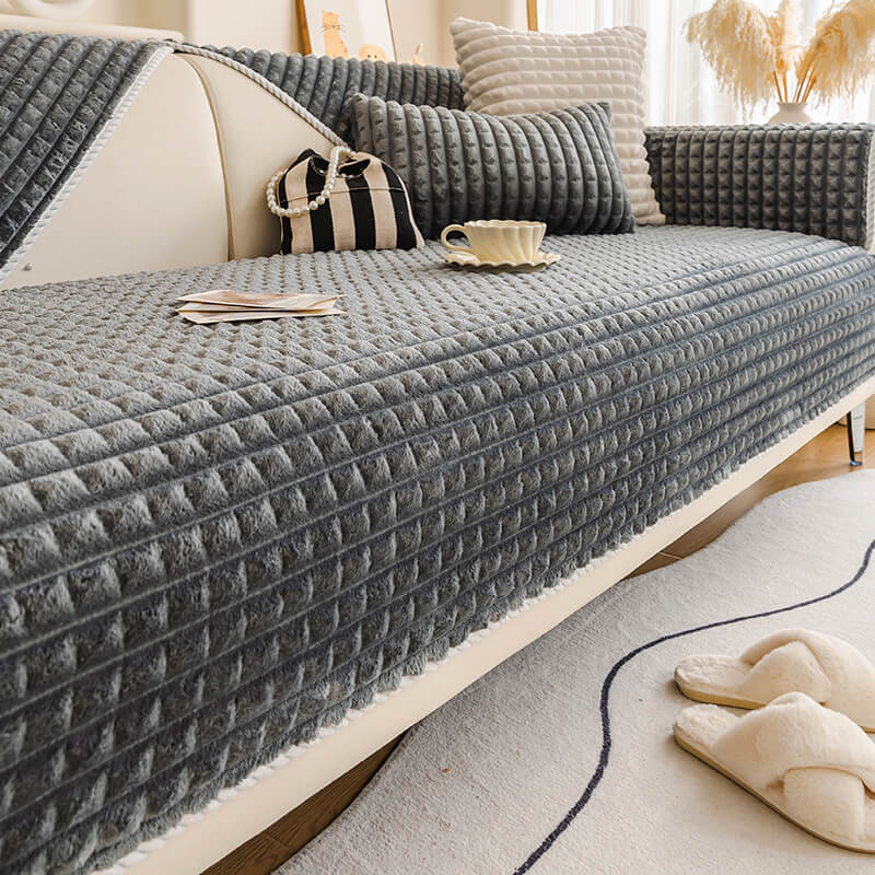 Sectional flannel sofa cover, washable and pet-friendly, protecting furniture from wear.