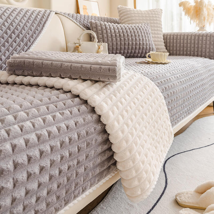 Close-up of flannel pet-friendly sofa protector texture, showing soft and durable fabric.