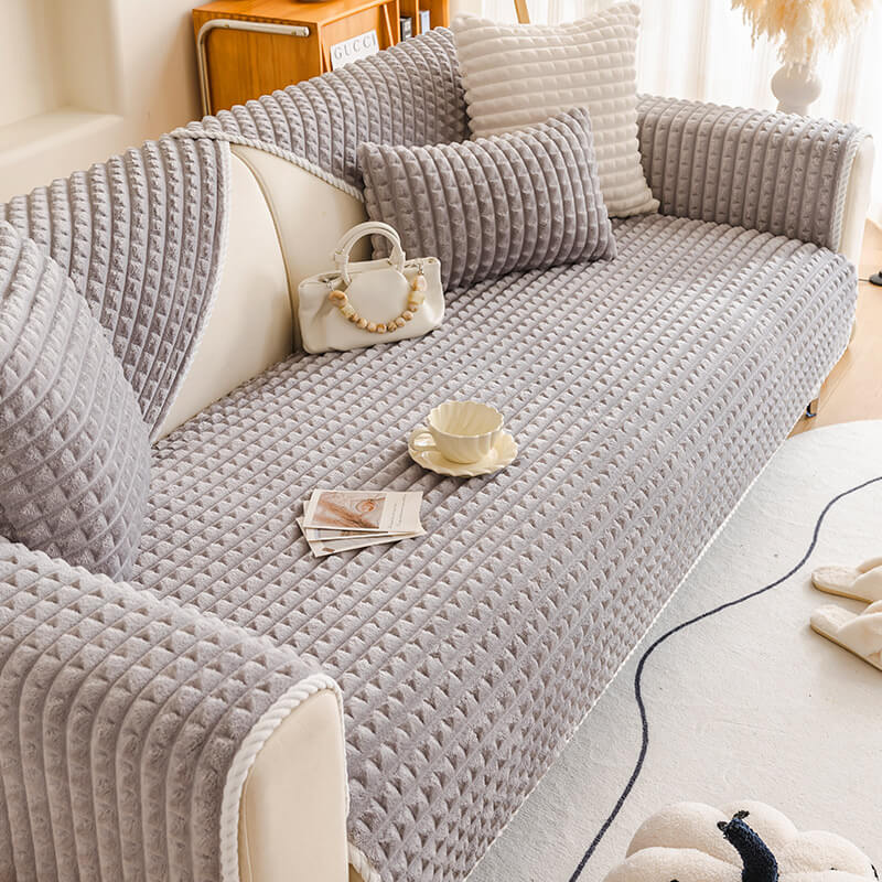 Full view of a couch with a non-slip flannel pet protector, enhancing couch decor.