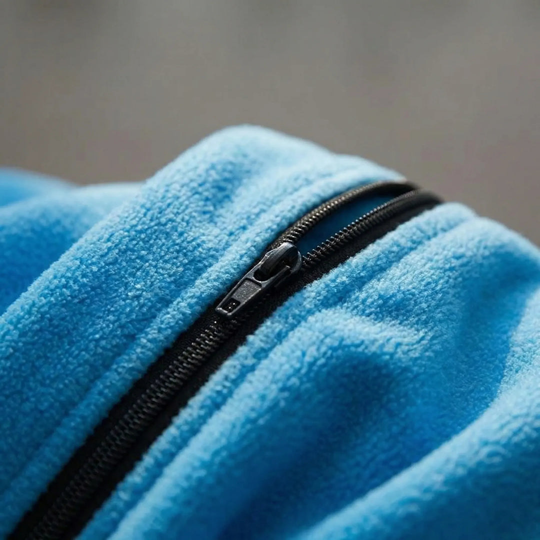 Lightweight unisex fleece sleeping bag for outdoor camping. Packable travel accessory, ideal for 3-season adventures.