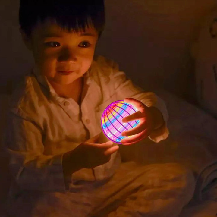 Indoor/outdoor flying toy: 360° gyroscope with bright, rechargeable LED lights. Fun interactive gift.