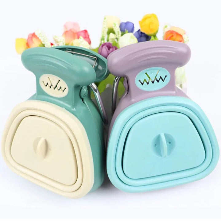 One-handed foldable dog scooper, ideal for pet waste, comes with a supply of biodegradable bags