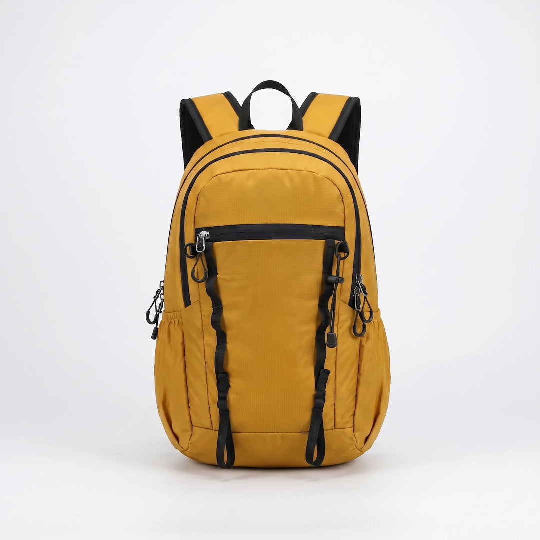 Folded cyan hiking daypack, ultra-compact & lightweight for easy packing in luggage or travel. Essential outdoor gear.