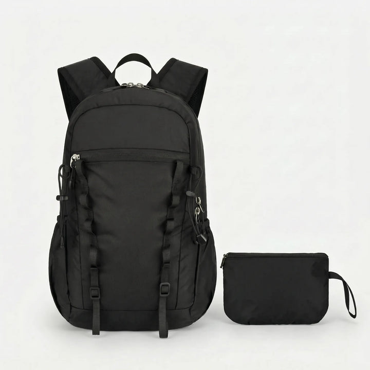 Compact, lightweight cyan foldable daypack shown with a water bottle. Essential outdoor gear for day trips.