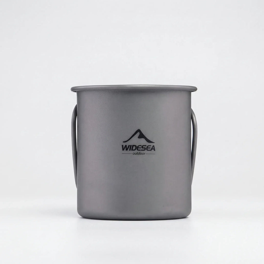 Versatile titanium travel mug, shown collapsed for easy storage, great for any outdoor activity or travel.