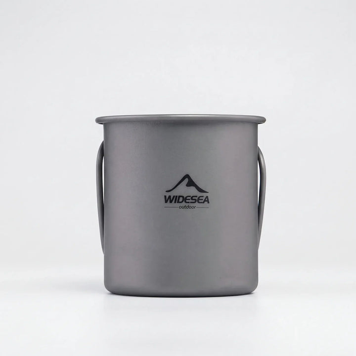 Versatile titanium travel mug, shown collapsed for easy storage, great for any outdoor activity or travel.
