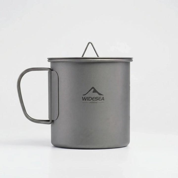 Durable and lightweight foldable titanium camping mug, an essential piece of outdoor cookware for any trip.