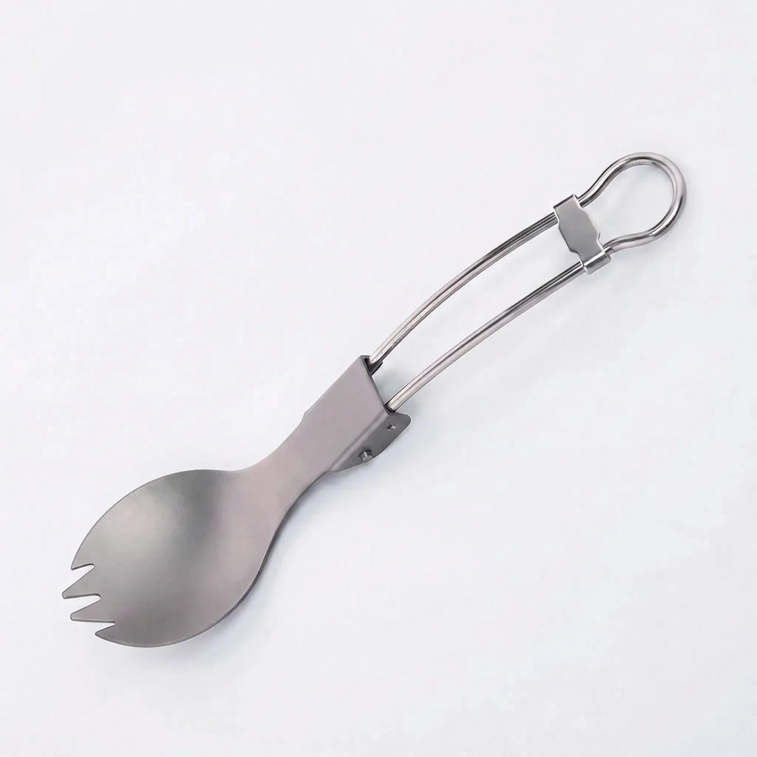 Compact titanium spork, perfect for travel & hiking. Foldable camping utensil, lightweight for easy packing.