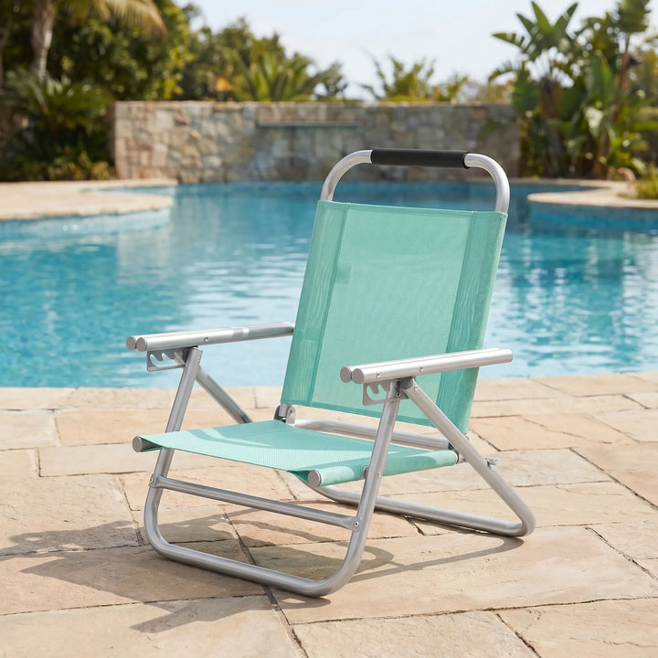 Unisex folding beach chair, adjustable for comfort. Perfect portable outdoor seating for beach or lawn relaxation.
