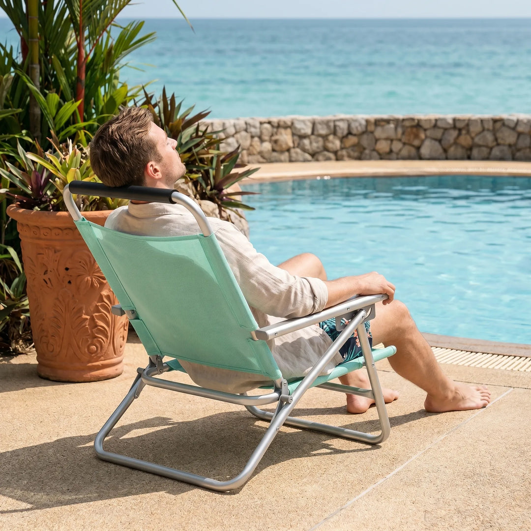 Versatile unisex lawn chair, adjustable & foldable. Great for beach, camping, or any outdoor relaxation spot.