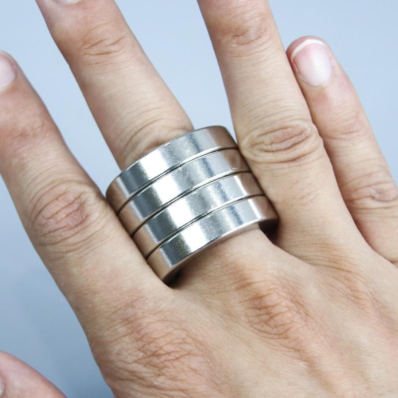 Unisex folding four-finger fidget ring, an anxiety relief & focus aid. A calming sensory device.