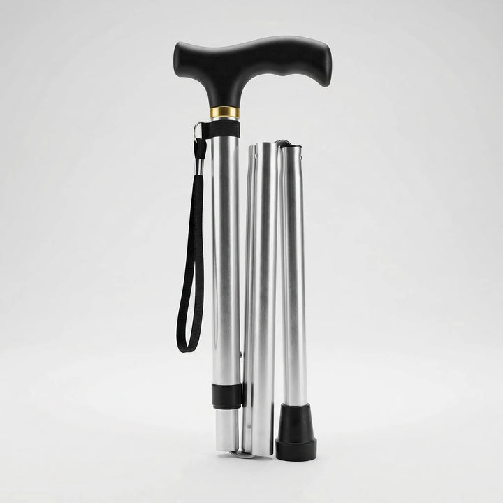 Compact folded walking cane, lightweight, ready for travel. Ideal portable mobility support for easy storage.