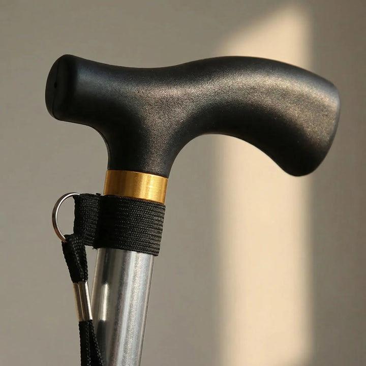 Adjustable unisex walking cane in use, providing stable support. Ergonomic handle, perfect for daily mobility.