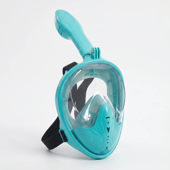 Full-face snorkel mask floating in clear ocean water, ready for an immersive panoramic underwater diving experience.