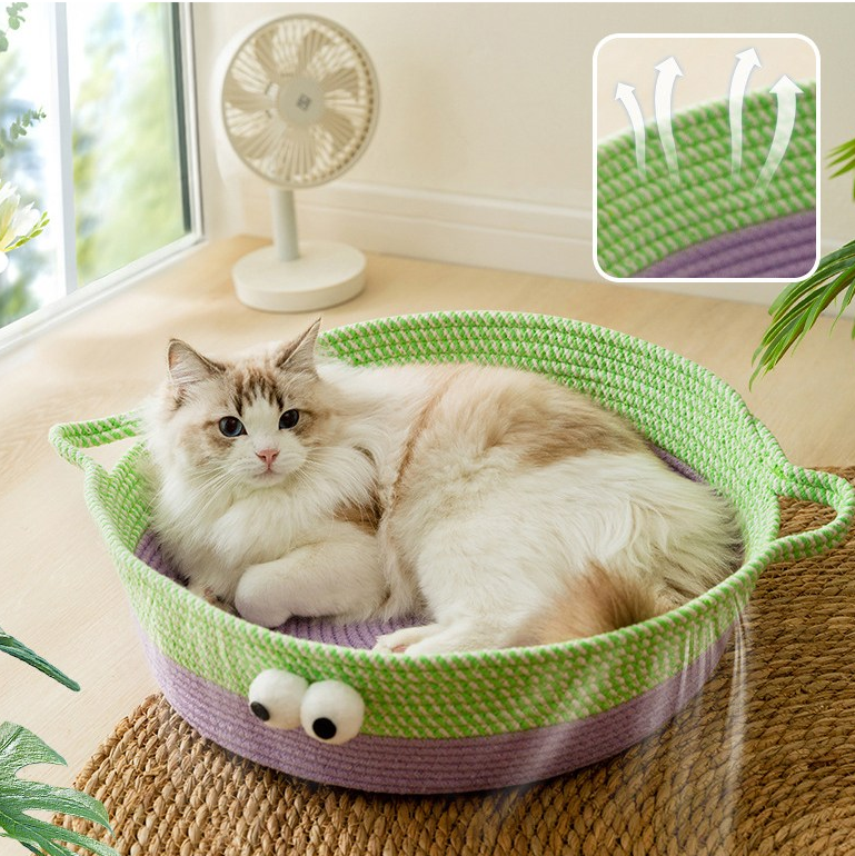 Cat resting comfortably in a hand-woven cotton rope bed, animal design, soft pet furniture