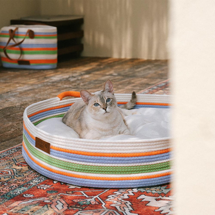 Pamper your pet with this handcrafted striped calming bed