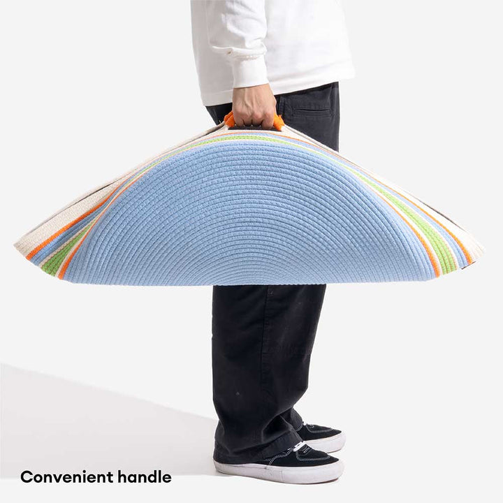 Soft, striped dog bed, handwoven to provide a calming sleep experience