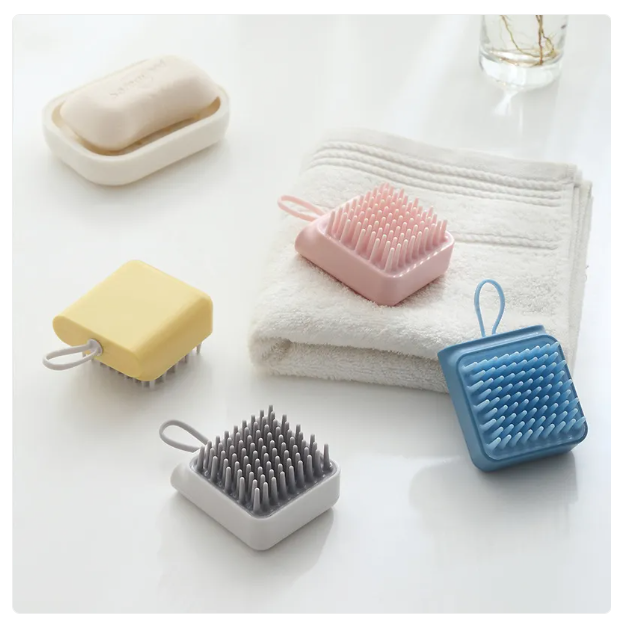 Compact handheld body massage brush, an essential skin care exfoliator for a refreshing daily ritual