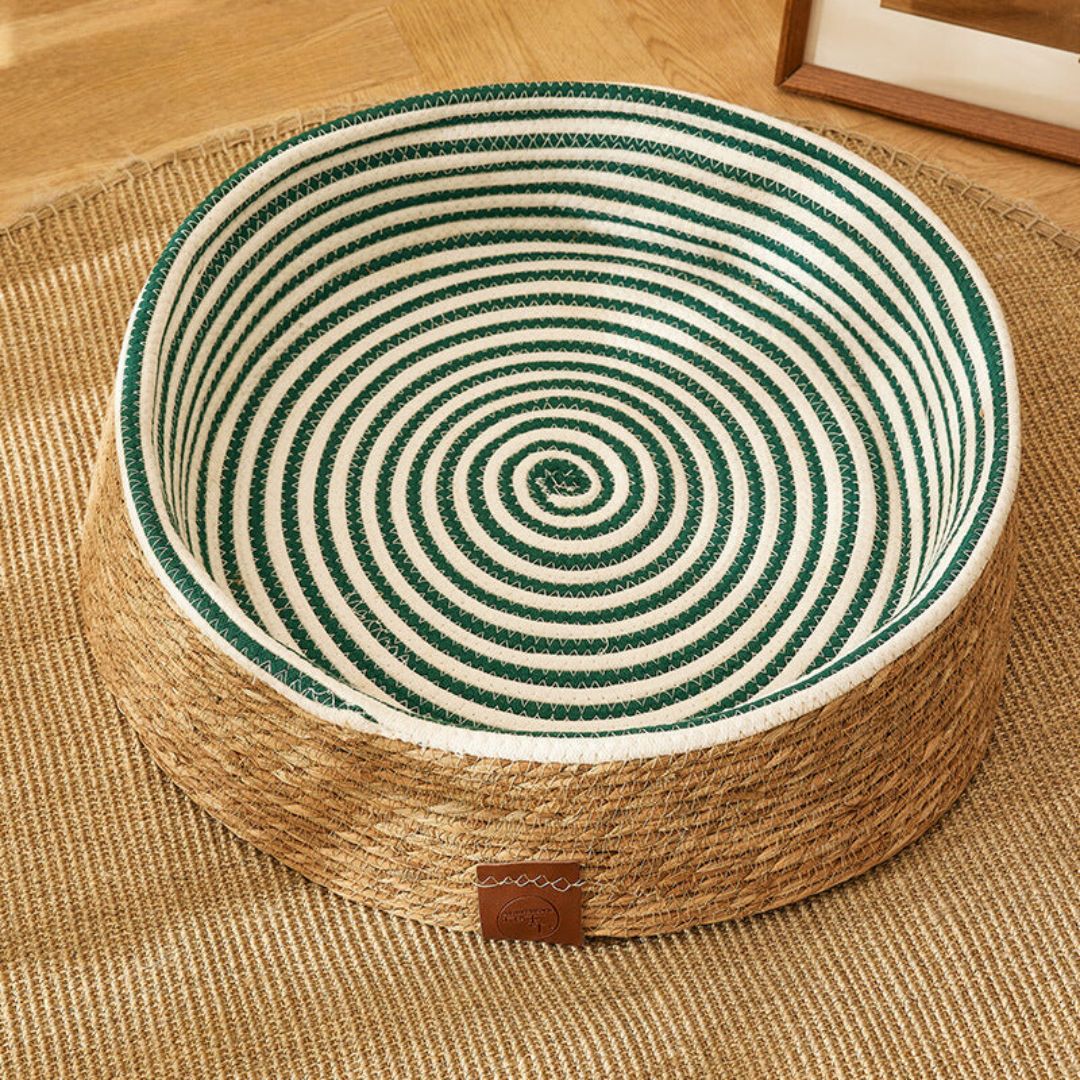 Stylish handwoven rattan cat house with integrated scratching post, including a plush cushion