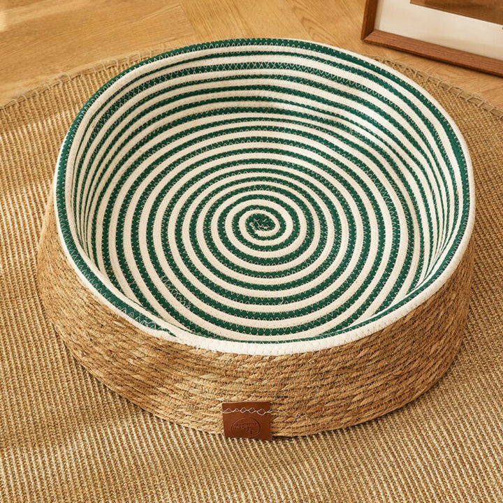 Stylish handwoven rattan cat house with integrated scratching post, including a plush cushion