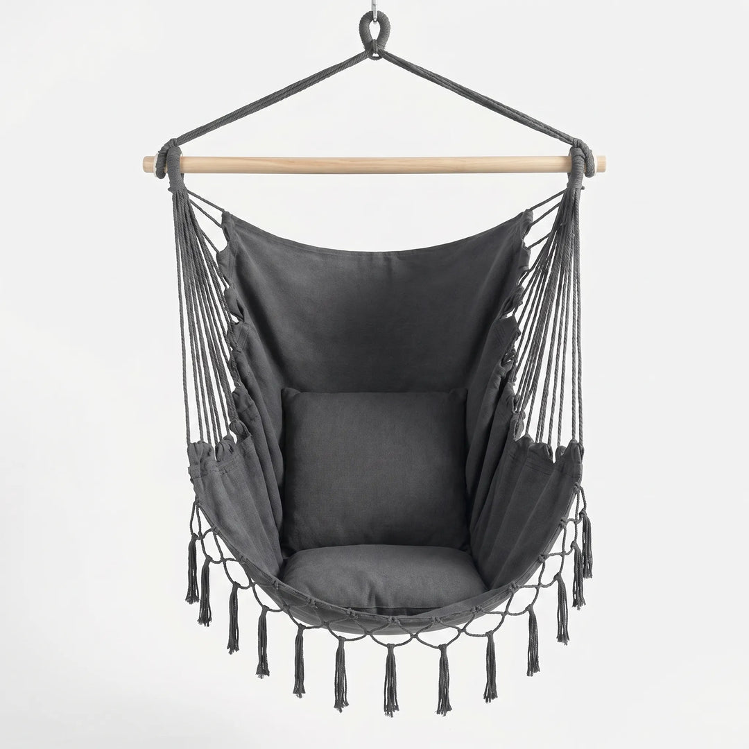 Boho canvas hanging hammock chair. Stylish indoor/outdoor swing for relaxation & space-saving home decor.