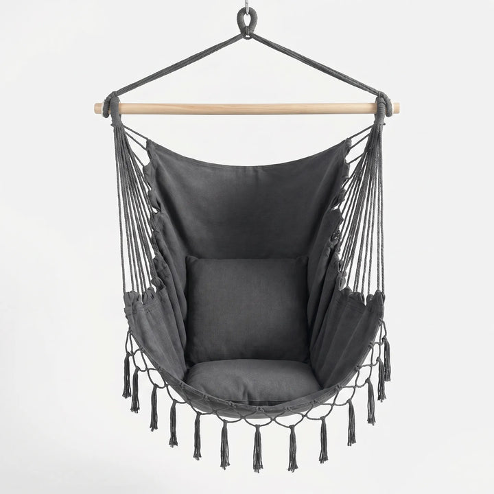 Boho canvas hanging hammock chair. Stylish indoor/outdoor swing for relaxation & space-saving home decor.