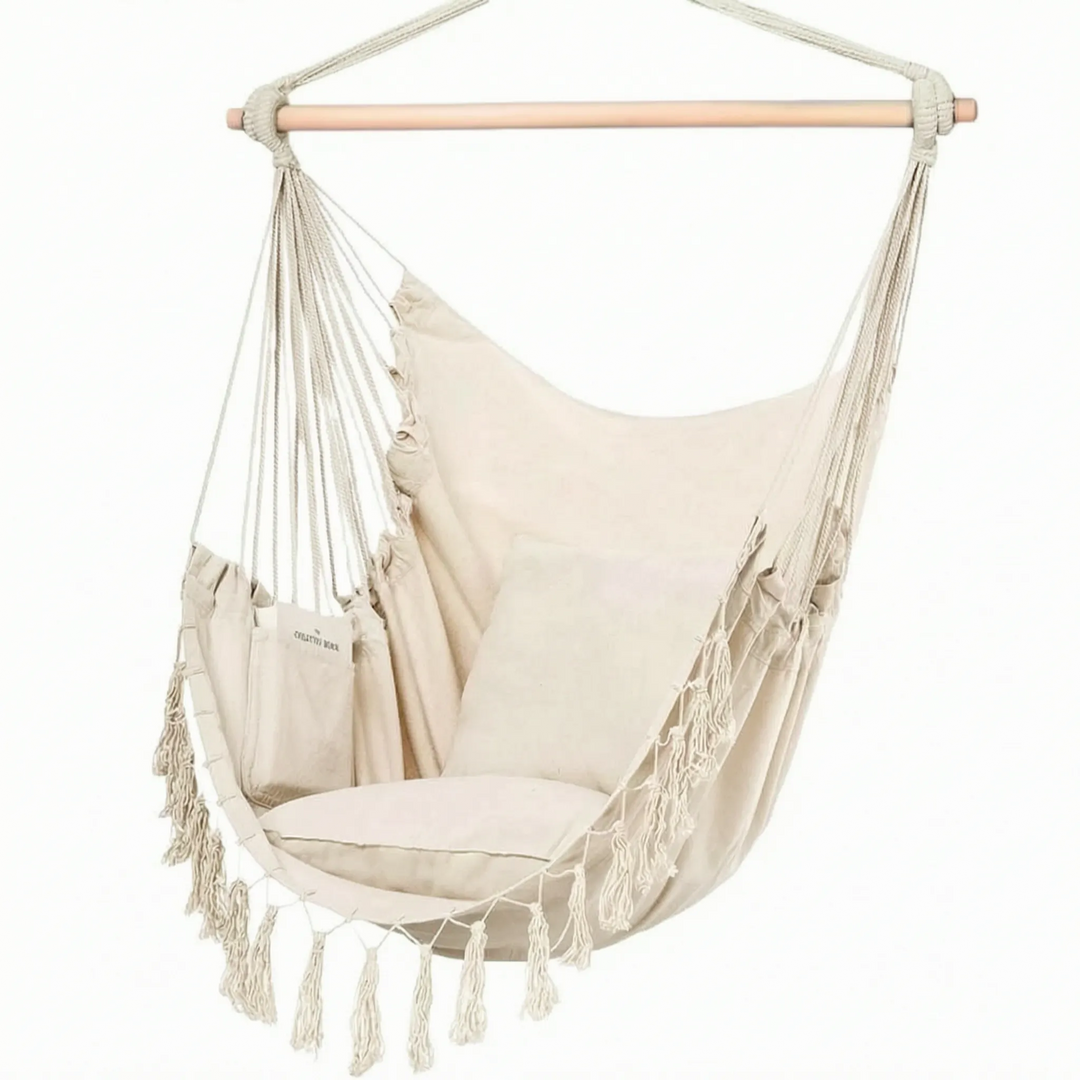 Stylish canvas hanging chair. Unisex swing hammock for indoor/outdoor relaxation, adding boho charm to any space.