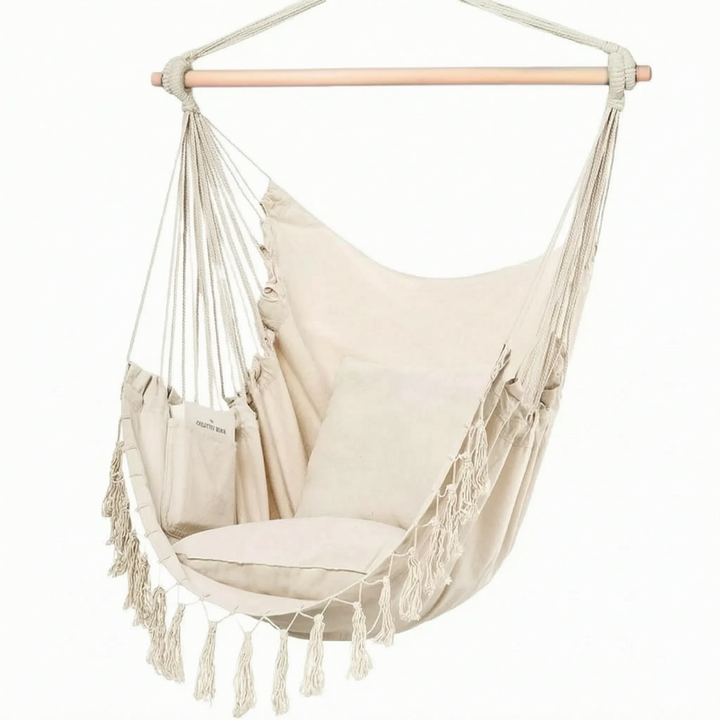 Stylish canvas hanging chair. Unisex swing hammock for indoor/outdoor relaxation, adding boho charm to any space.
