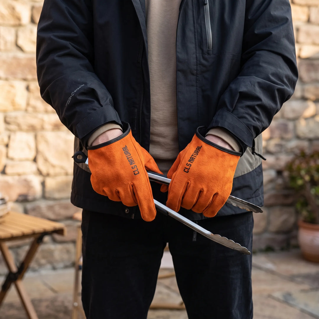 Unisex heat-resistant gloves for outdoor grilling, BBQ, and campfire cooking. Durable fire protection work gloves.